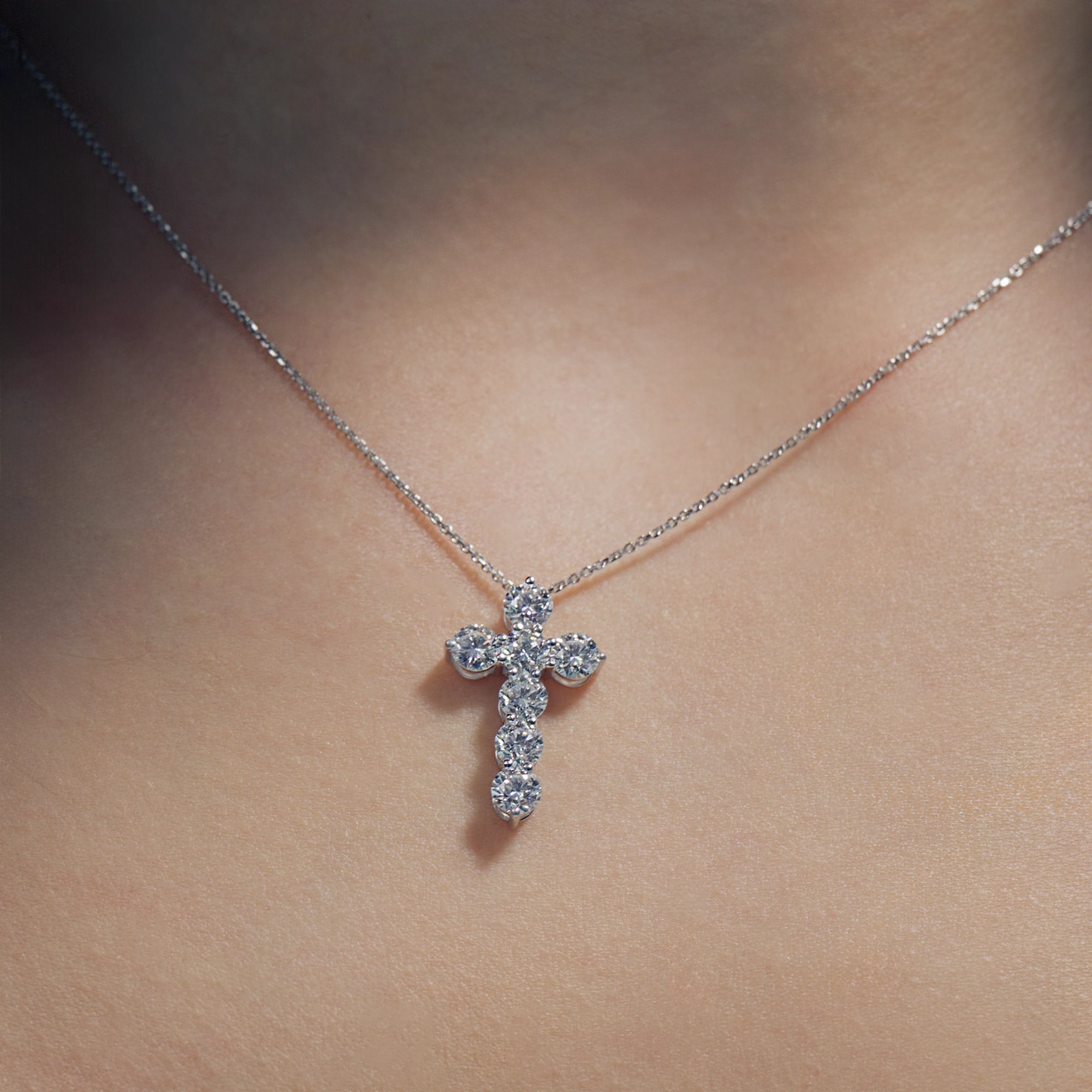 Round Lab Diamonds Cross Pendant on model's neck