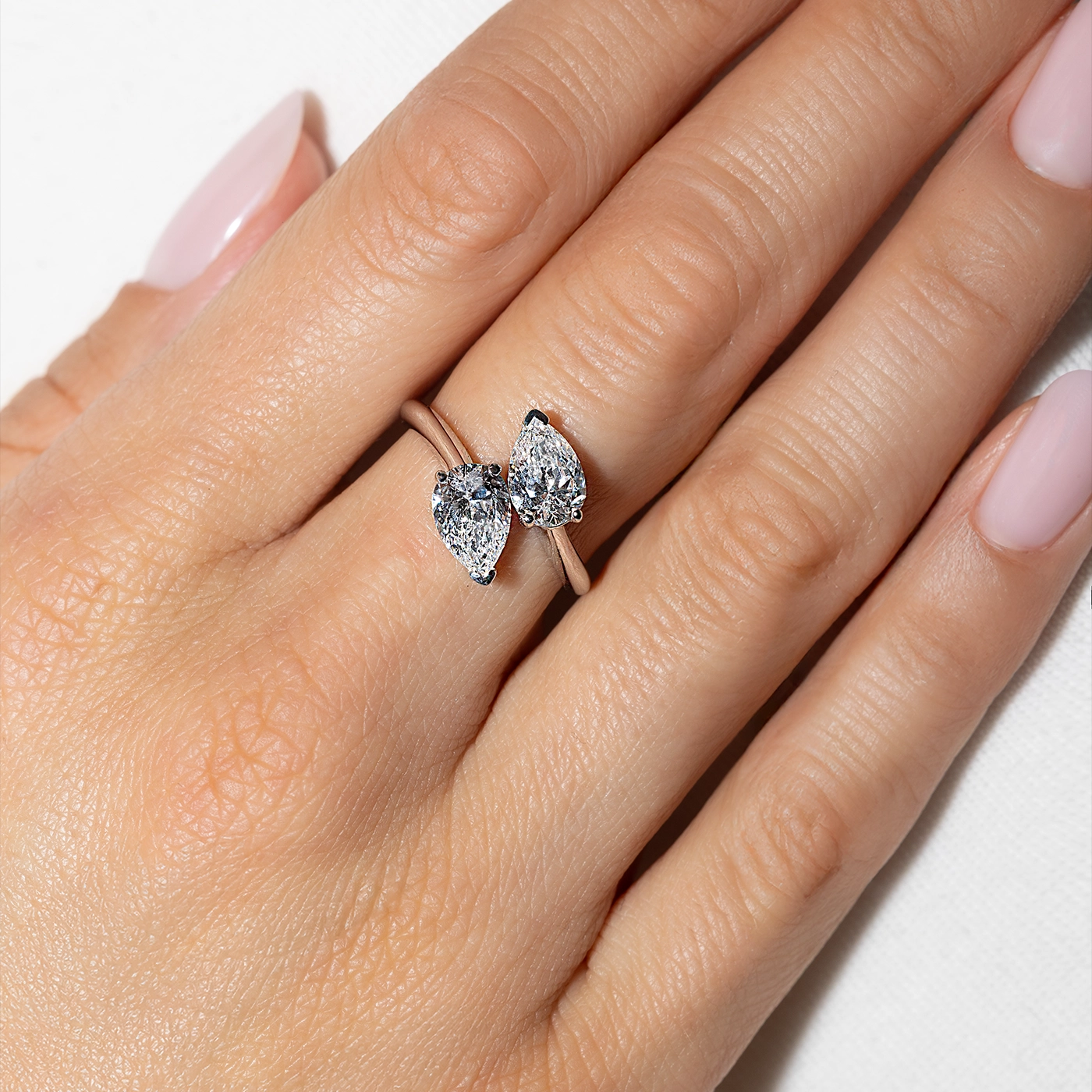 Pear-cut lab diamond Toi Moi ring in white gold band on finger