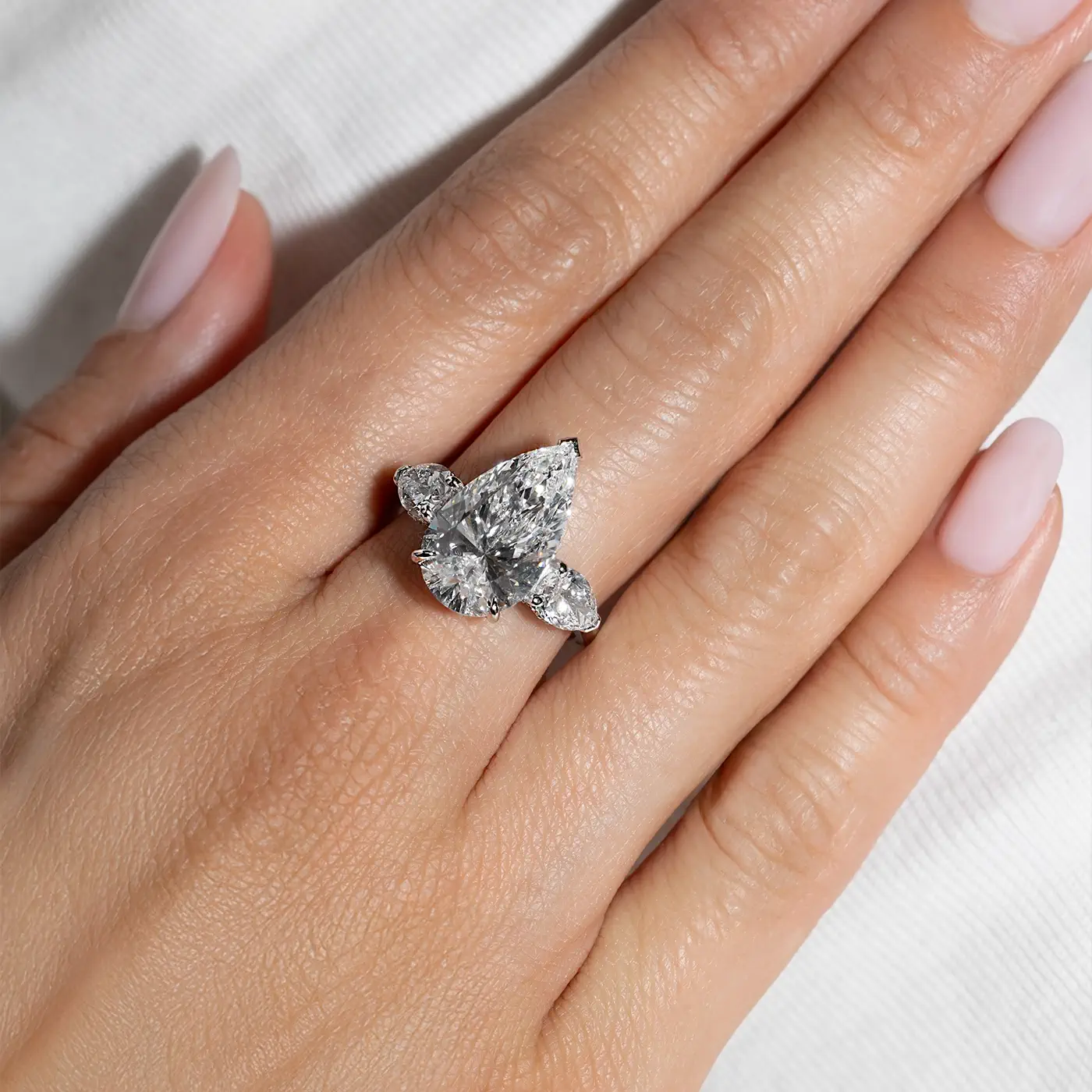 Pear and pear-cut lab-grown diamond trilogy on hand in white gold