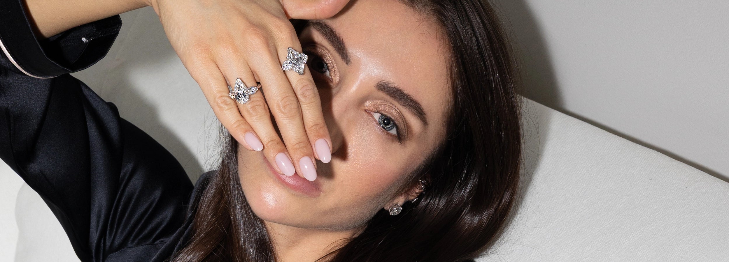 Model wearing diamond rings on hand, luxury fine jewelry by BÄL Diamonds
