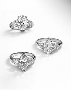 Pear, Oval, Marquise-cut Diamonds in white gold with heart shape side stone with an engravement of BAL Logo 