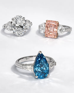 Luxury engagement rings featuring oval, emerald-cut, and pear-shaped gemstones with diamond accents