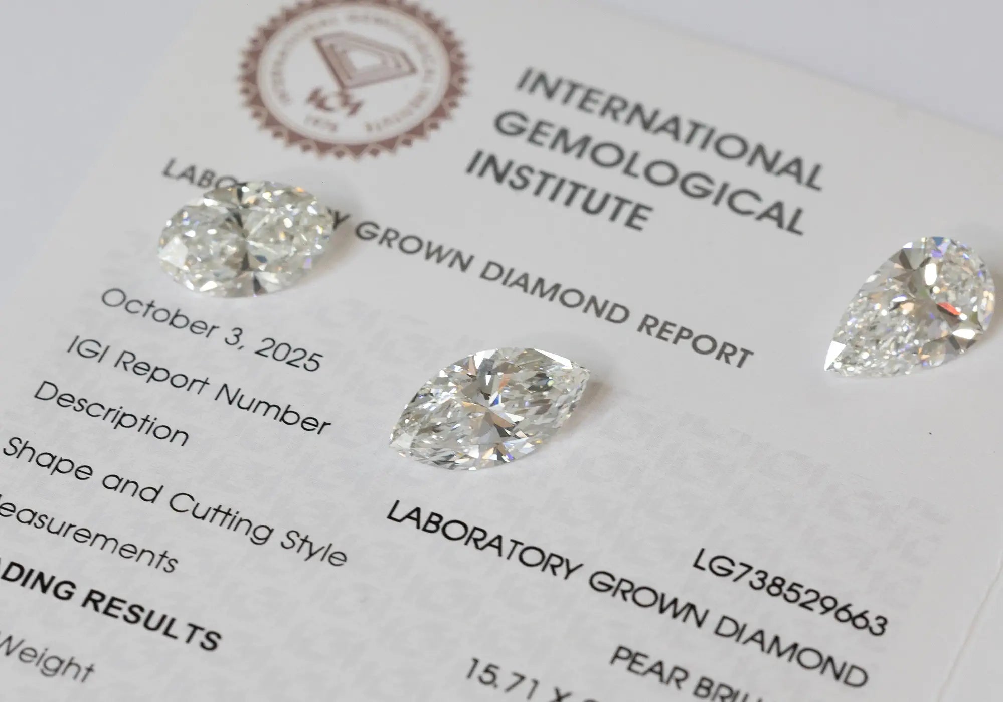 Different cuts/shapes of lab-grown diamonds on top a IGI certificate