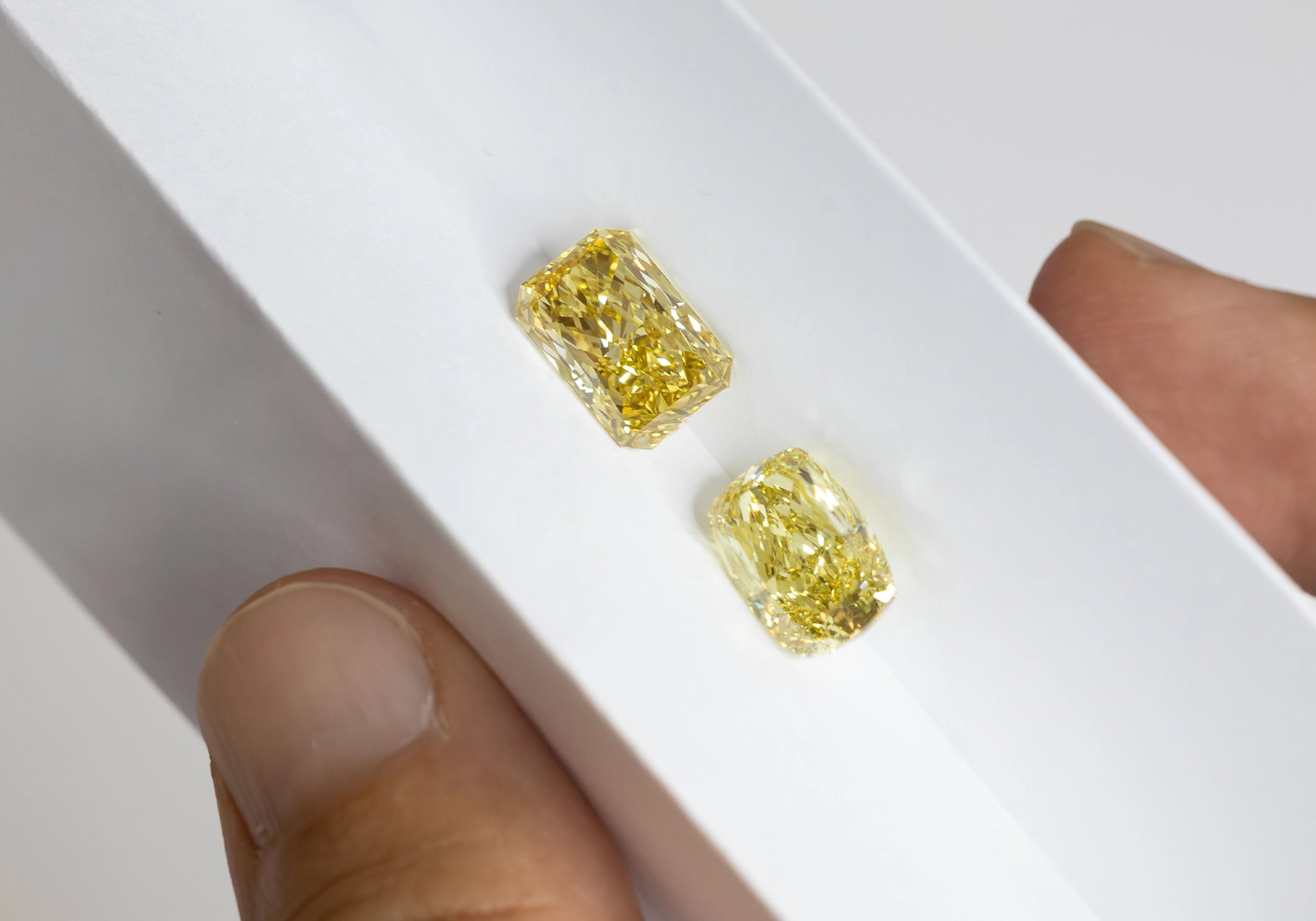 Fancy Yellow Loose Diamonds on a White Bond Paper