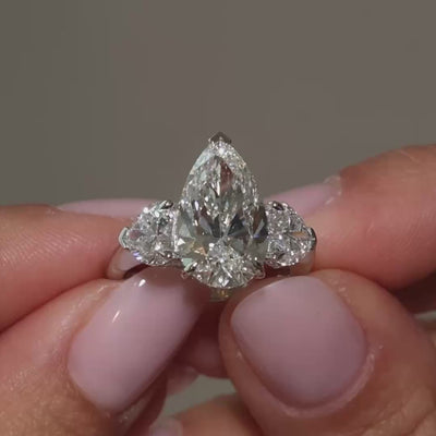 A video clip of pear-shaped lab diamonds heart trilogy in 18k white gold