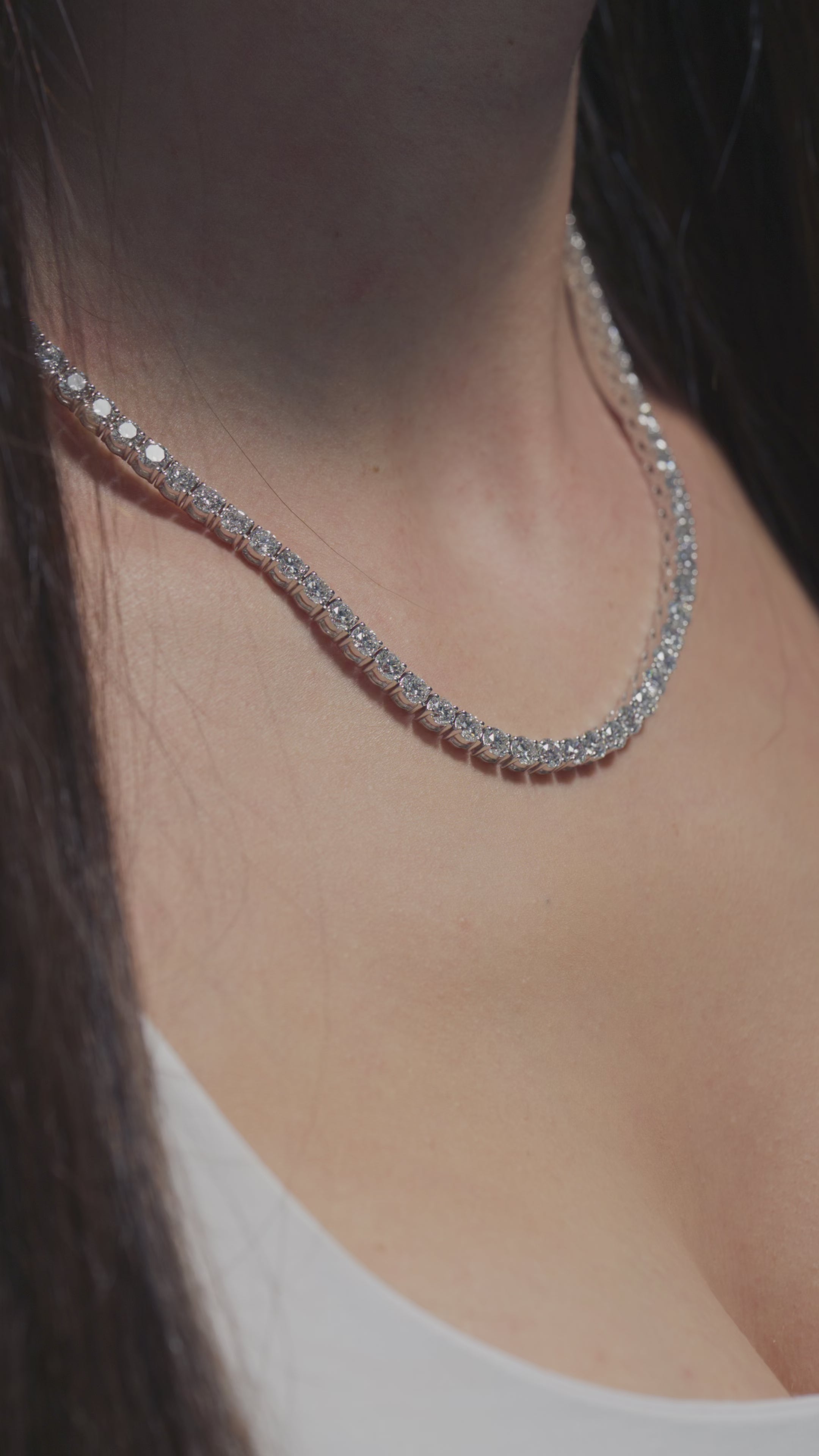A video of a 27.6ct Round Lab Diamonds Tennis Necklace shown off by the model
