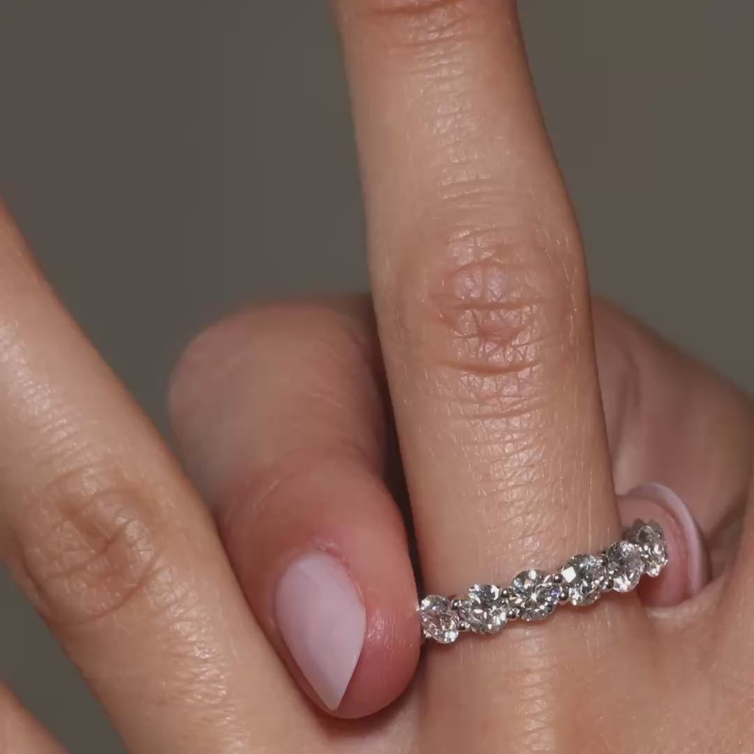 Round lab-grown diamonds eternity ring in 18K gold, video showing full band and sparkling diamonds.