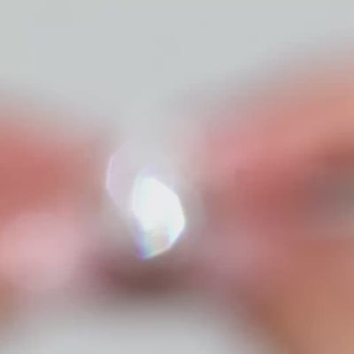 Video of a pear-shaped lab diamond with pear side stones showcased by the model 